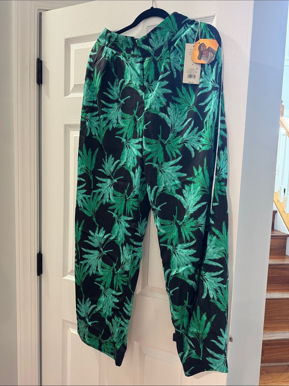 Fe Noel for Target wide leg pants feature a vibrant green and black palm print